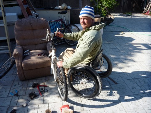 Crankshaft welded to handle bar neck, front fork with geared rear wheel attached.