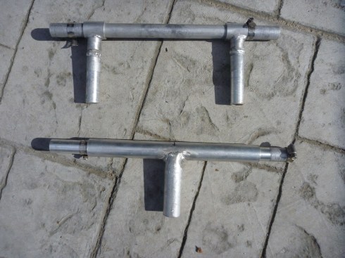 Standard aluminum tubing, welded, creates rigid attachment between hand cycle and wheelchair