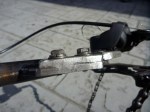 Picture showing steel plate welded bottom right leg of the bicycle point allowing for bolted de-railer attachment. Standard de-railer was scrapped from the rear of donor bicycle.