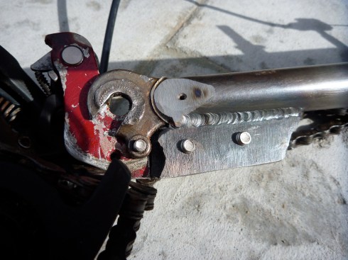 Backside of steel plate that was welded to the bicycle fork for the de-railer attachment point.