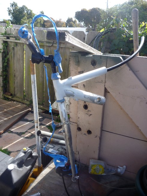 Prior to paint. Notice front fork legs were bent straight in order to perfect the very important angle of the front wheel, affecting the heigth that the wheelchairs casters come off the ground as well as the amount of weight on the front drive wheel.